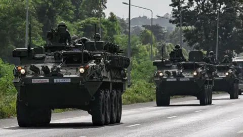AFP via Getty Images Thailand's soldiers move in armoured vehicles. Photo: 24 July 2025