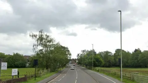 The B4361 a single lane carriageway with green land either side 