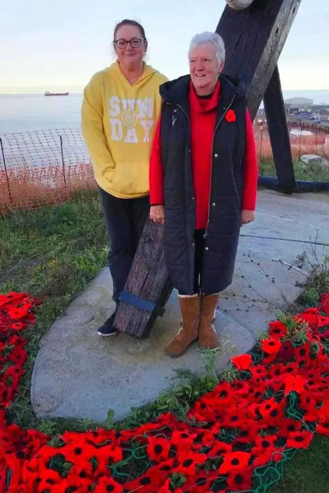 Claire Nicholson Claire Nicholson, 48, coordinator of the display, and her friend Helen Gow, 70 who has helped her since 2018 in the church ground with the display
