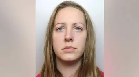 Cheshire Constabulary A police mugshot of Lucy Letby who stares at the camera with a blank expression